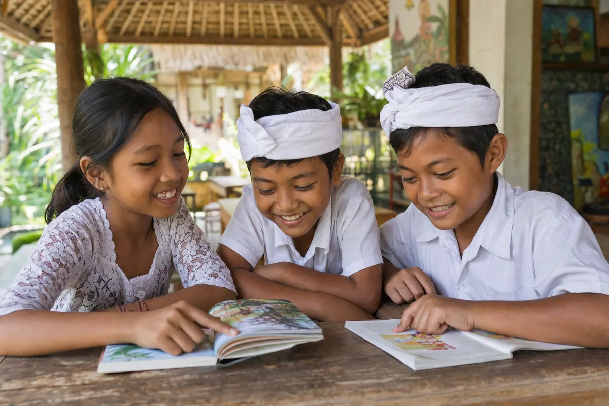Balinese children reading together
