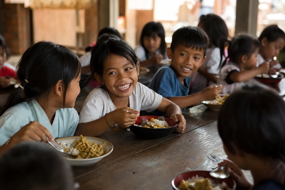 Balinese children sharing a meal together